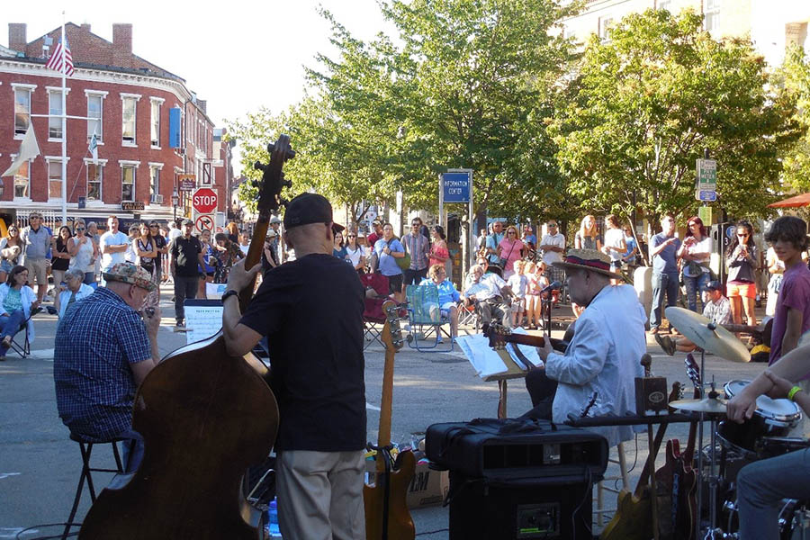 Street band performing for a crowd in downtown Portsmouth